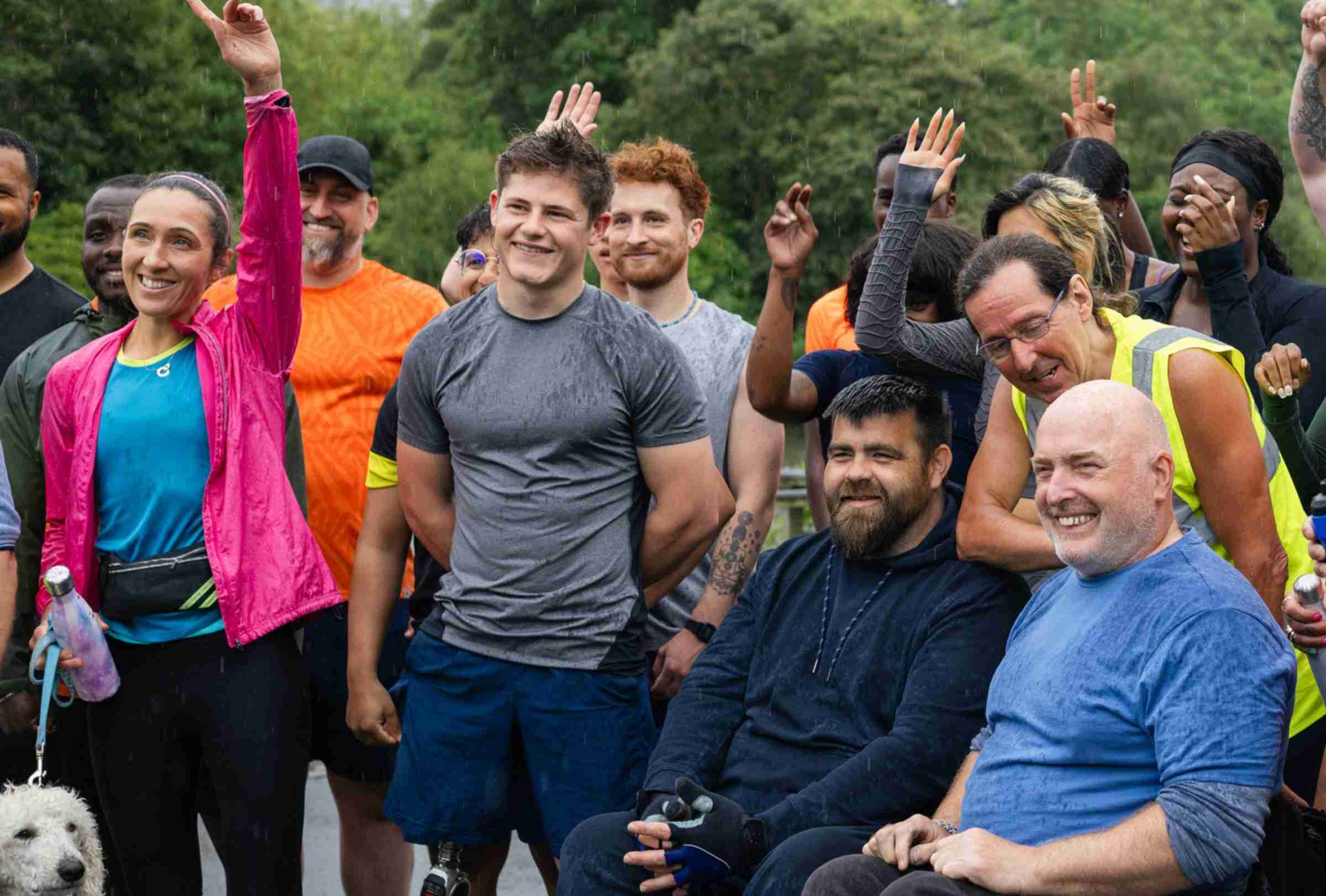 People In Exercise Clothes Raising Their Hands Getting Ready For A Race