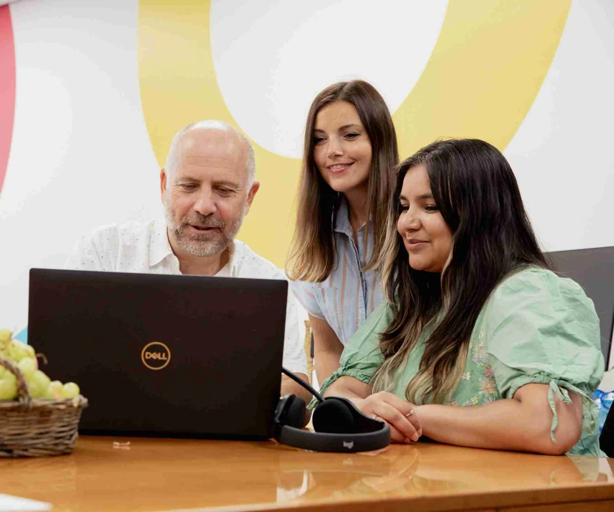 GWCU Membership And Operations Team Working Together On A Laptop